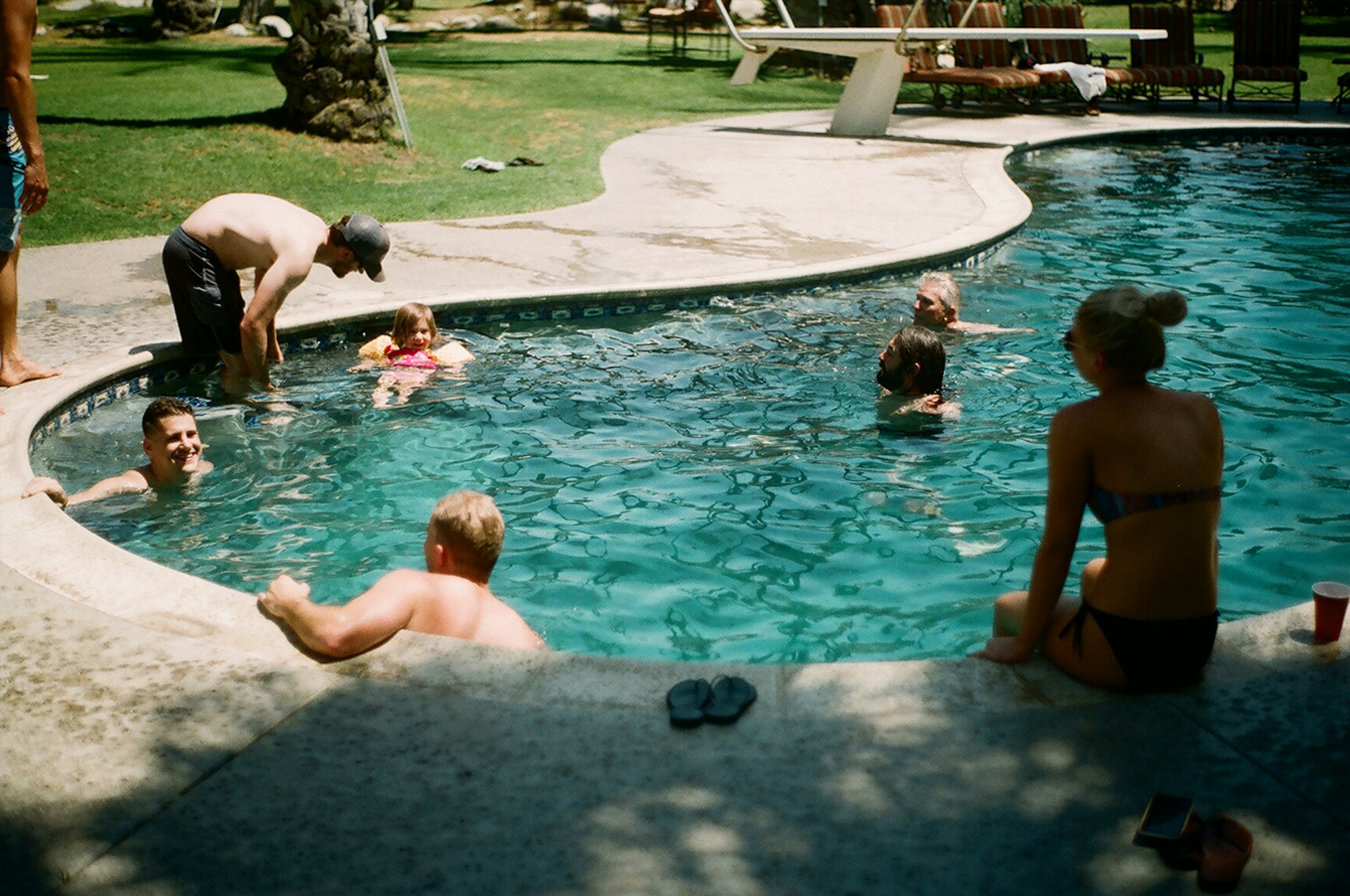 A sunny afternoon by a swimming pool